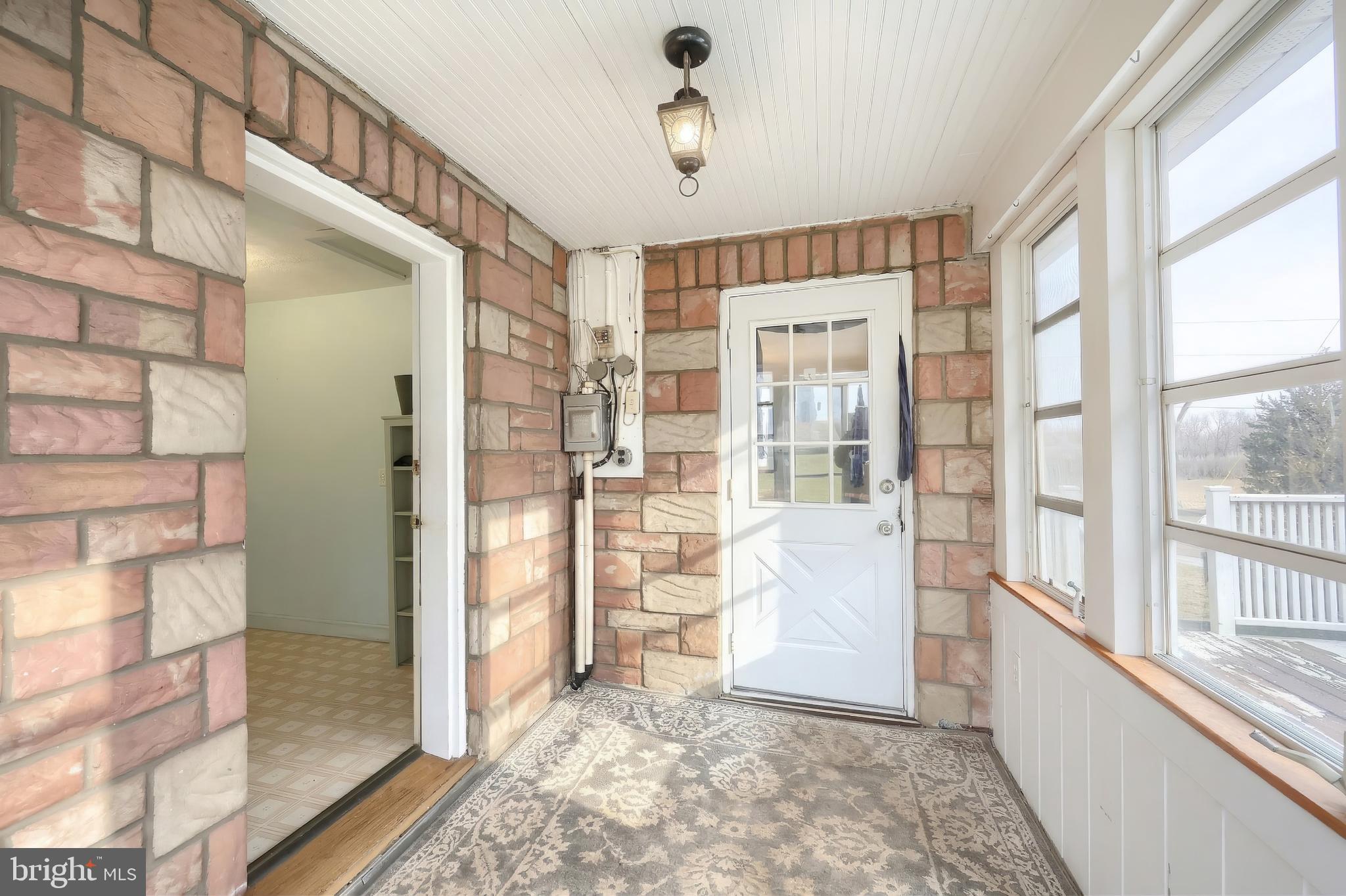 754 Bridgeton Road Fawn Grove, PA 17321 - Photo 21 of 42 a view of an entryway with wooden floor and windows
