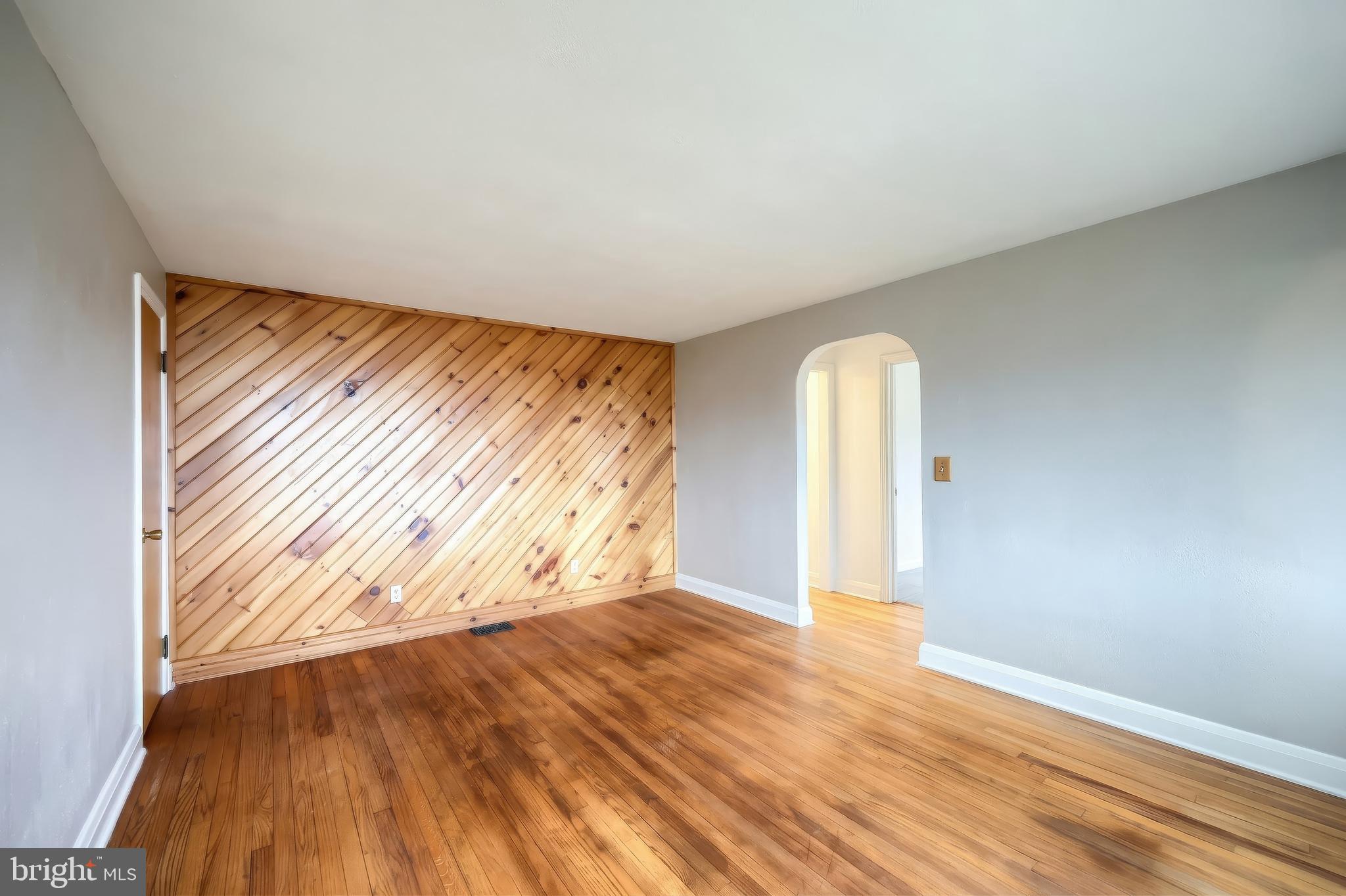 754 Bridgeton Road Fawn Grove, PA 17321 - Photo 27 of 42 an empty room with wooden floor and windows
