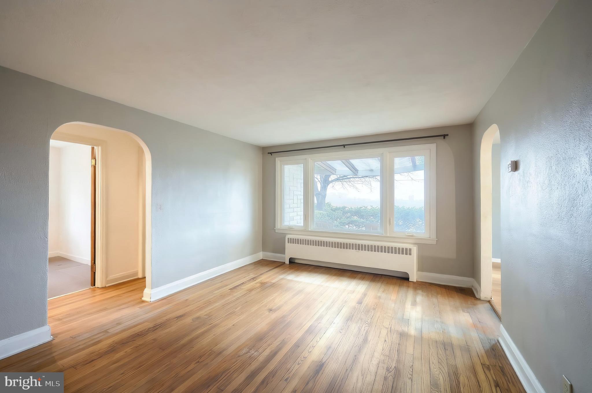 754 Bridgeton Road Fawn Grove, PA 17321 - Photo 28 of 42 an empty room with wooden floor and windows