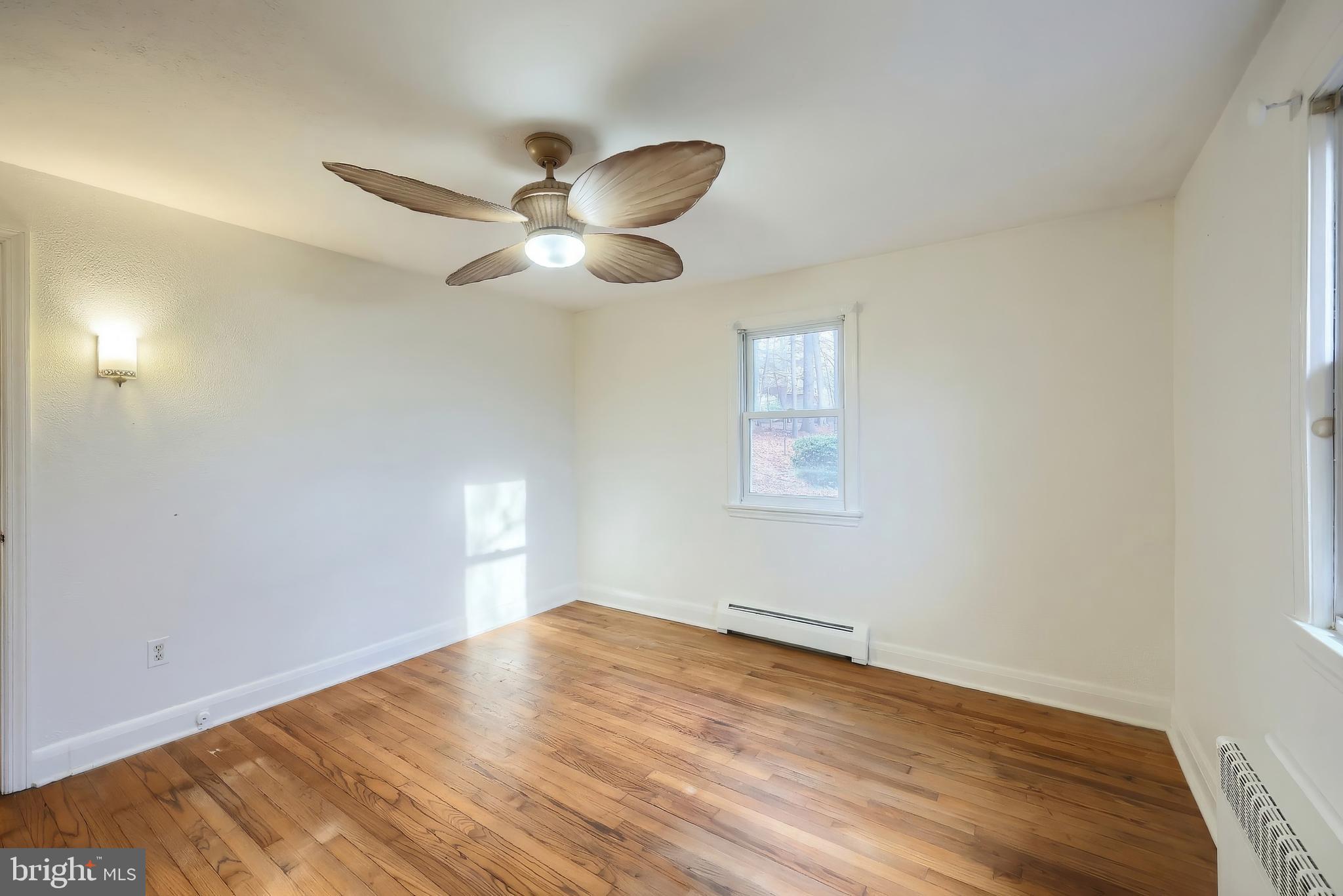 754 Bridgeton Road Fawn Grove, PA 17321 - Photo 30 of 42 a view of empty room with wooden floor and fan