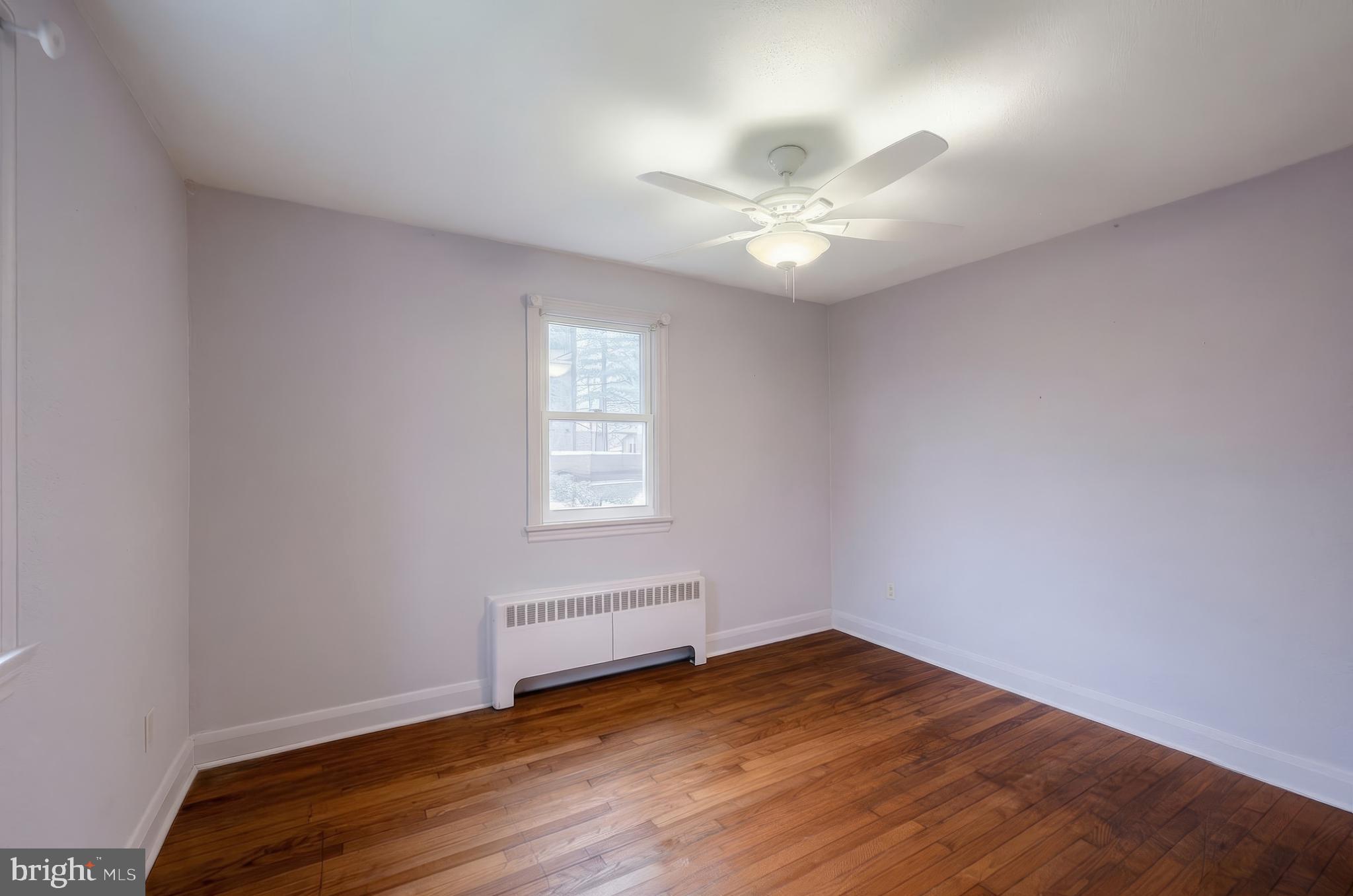 754 Bridgeton Road Fawn Grove, PA 17321 - Photo 31 of 42 wooden floor in an empty room with a window