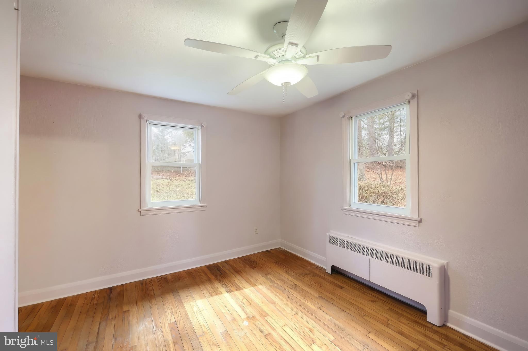 754 Bridgeton Road Fawn Grove, PA 17321 - Photo 32 of 42 a view of an empty room with wooden floor and a window