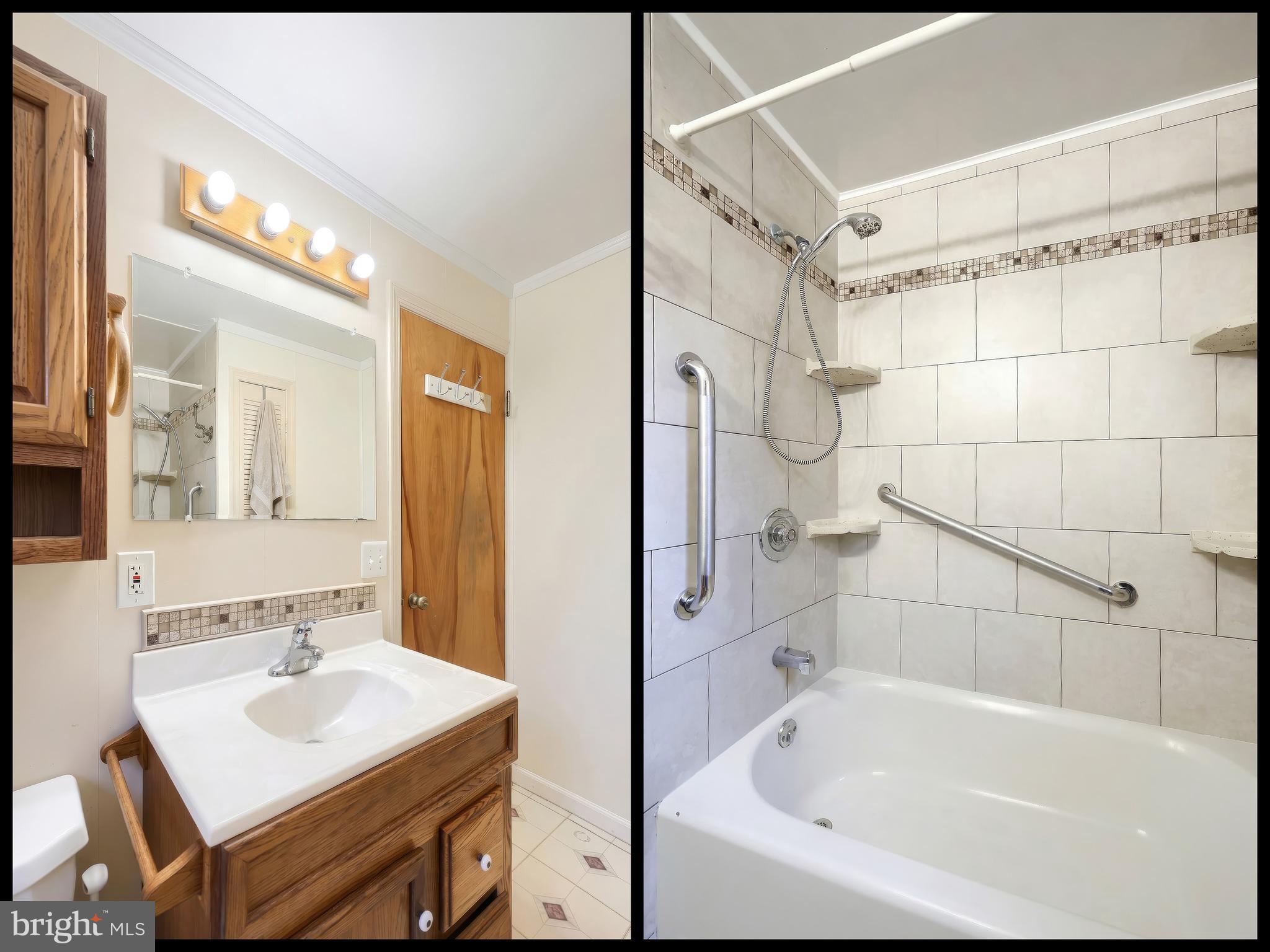 754 Bridgeton Road Fawn Grove, PA 17321 - Photo 37 of 42 a bathroom with a sink mirror and a bathtub