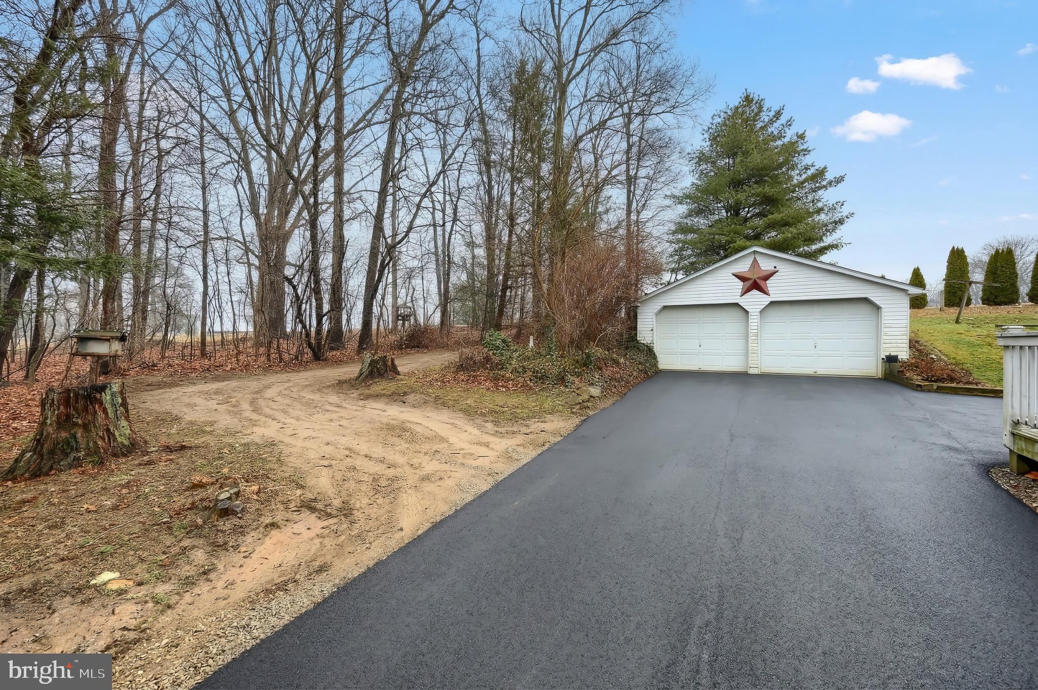 754 Bridgeton Road Fawn Grove, PA 17321 - Photo 7 of 42 a front view of a house with a yard and covered with snow