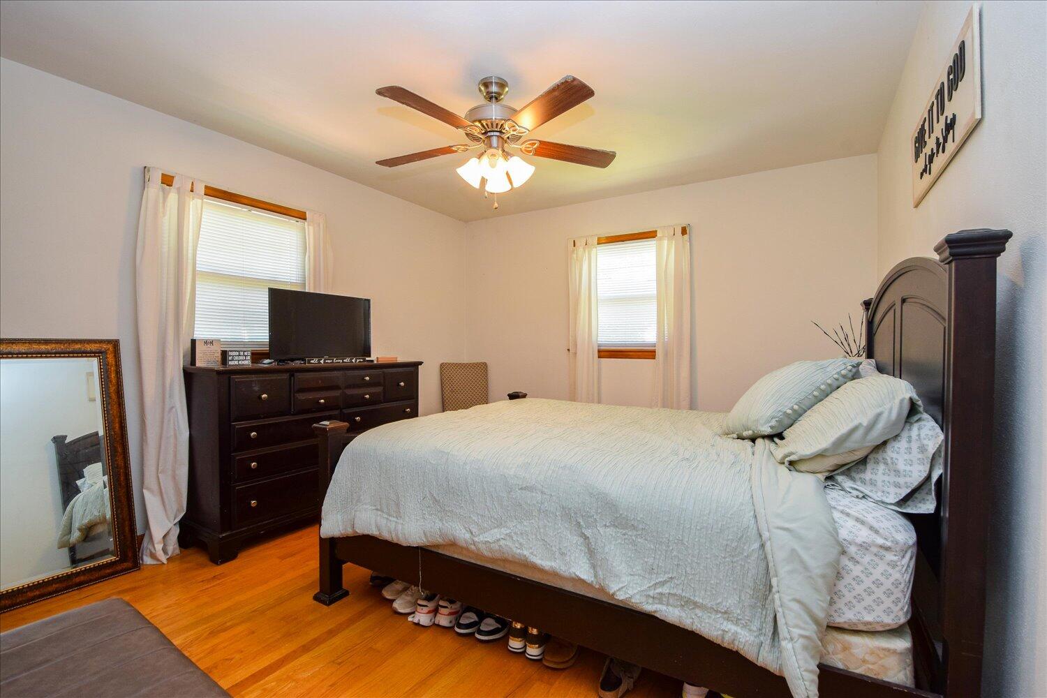 1518 Mountain View Road Vinton, VA 24179 - Photo 11 of 25 a bedroom with a bed and wooden floor