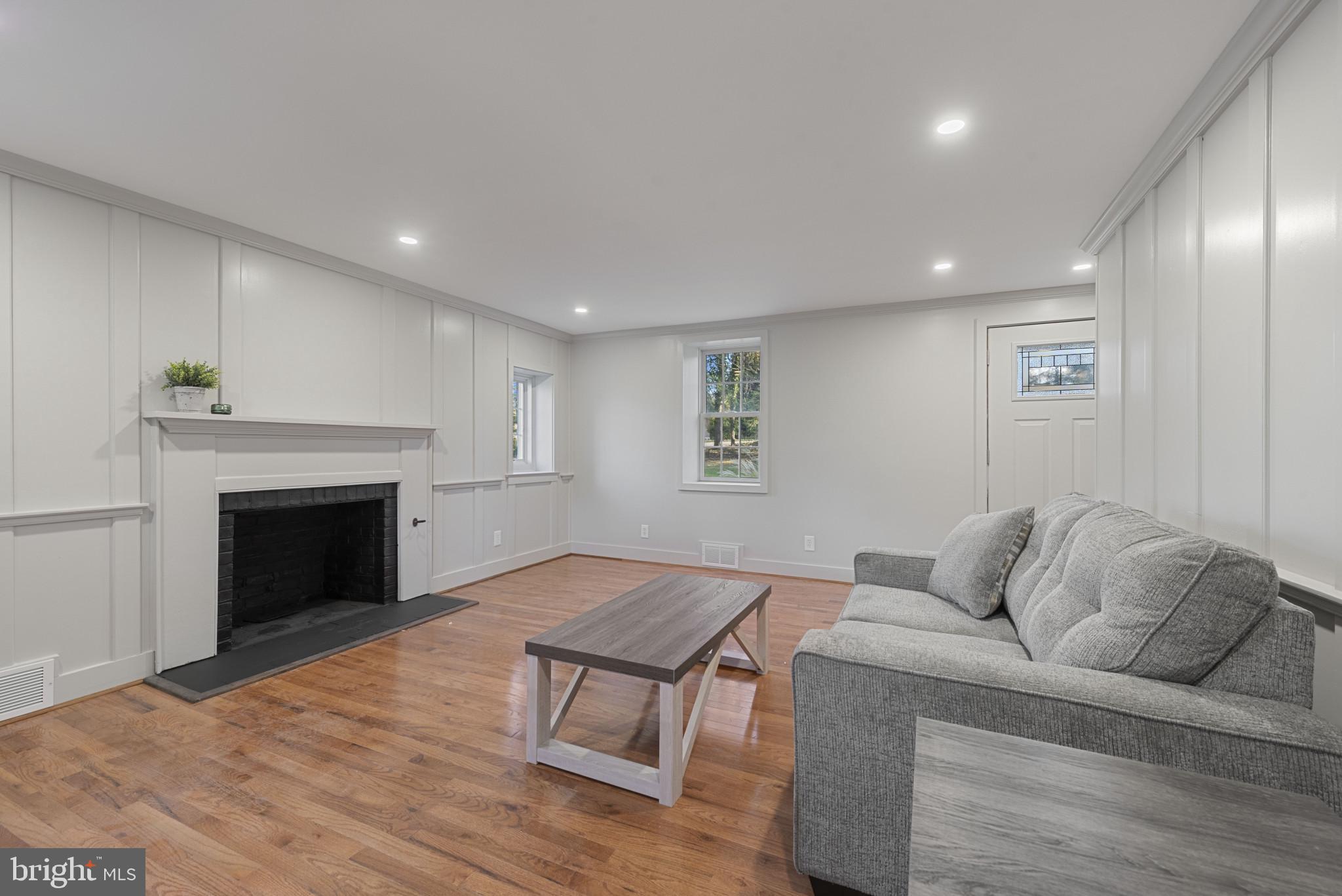 504 Hampton Lane Baltimore, MD 21286 - Photo 12 of 31 a living room with furniture and a fireplace