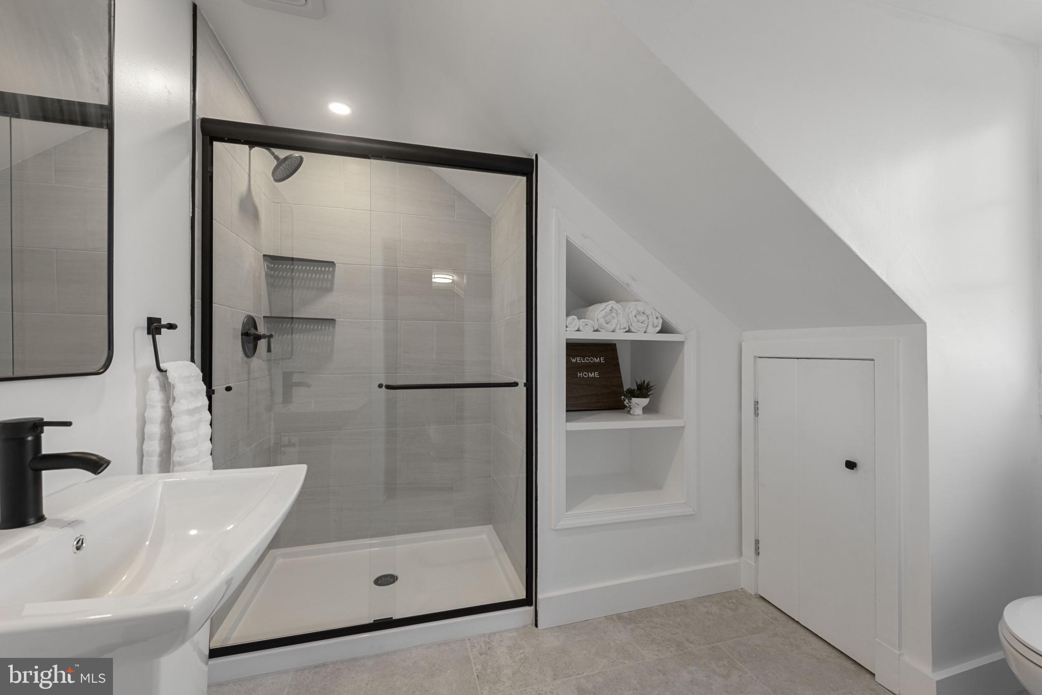 504 Hampton Lane Baltimore, MD 21286 - Photo 17 of 31 a bathroom with a tub and a shower