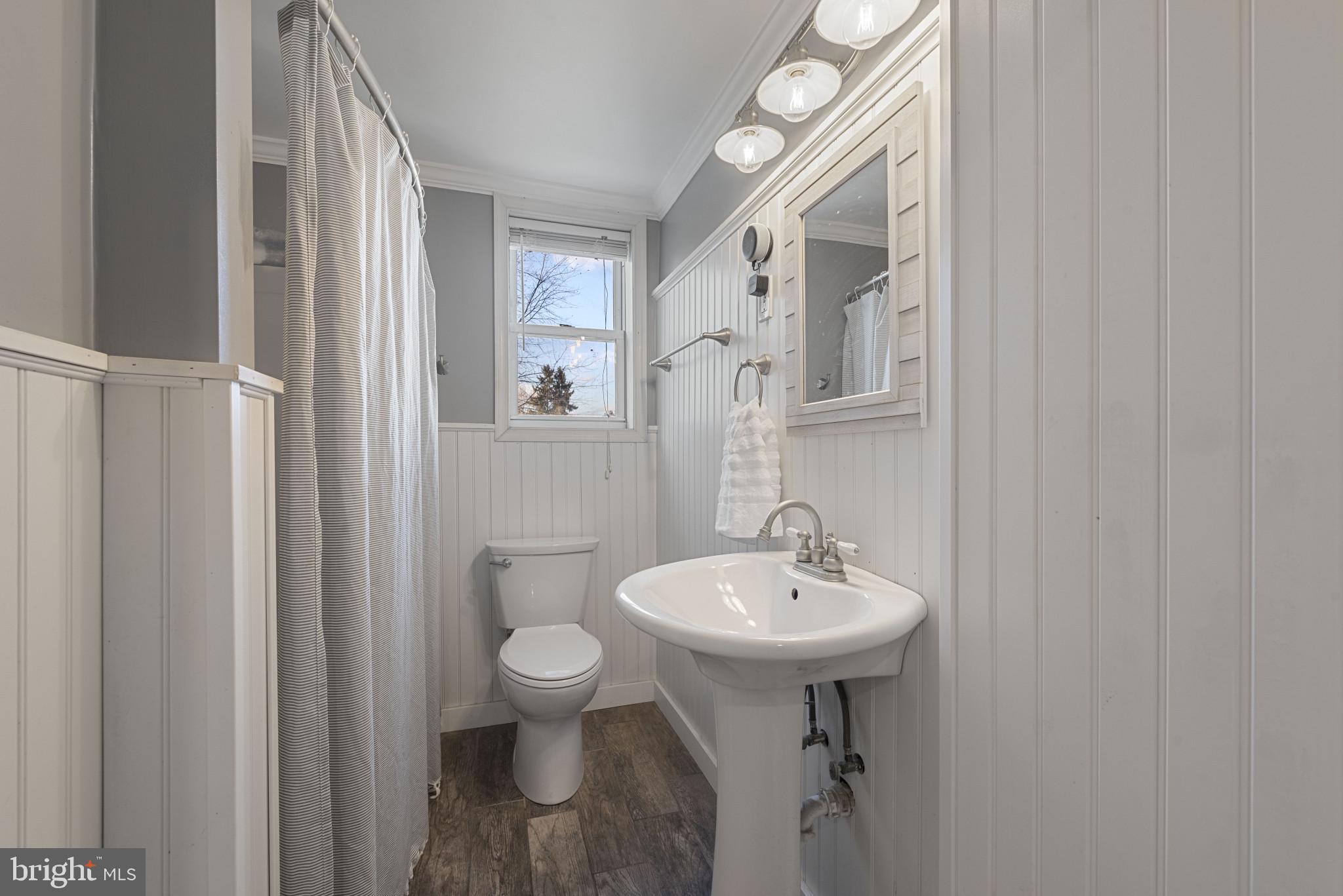 504 Hampton Lane Baltimore, MD 21286 - Photo 20 of 31 a bathroom with a sink toilet and shower