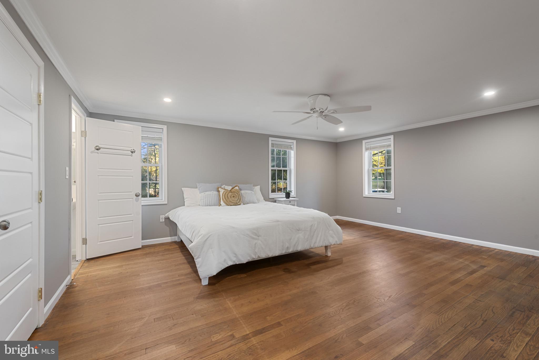 504 Hampton Lane Baltimore, MD 21286 - Photo 22 of 31 a spacious bedroom with a bed and a window