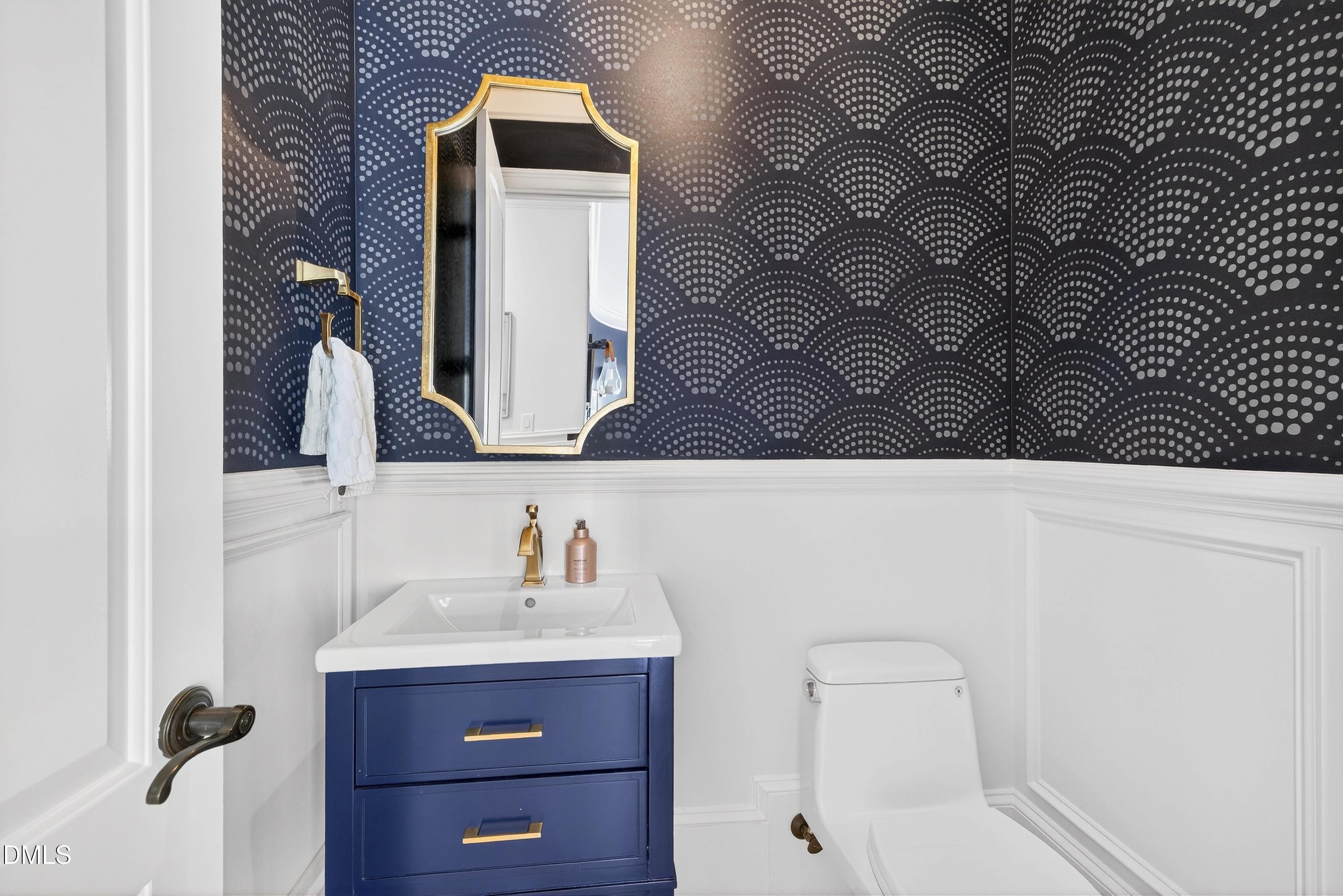 6701 Foxfire Place Raleigh, NC 27615 - Photo 34 of 67 a bathroom with a sink and a mirror