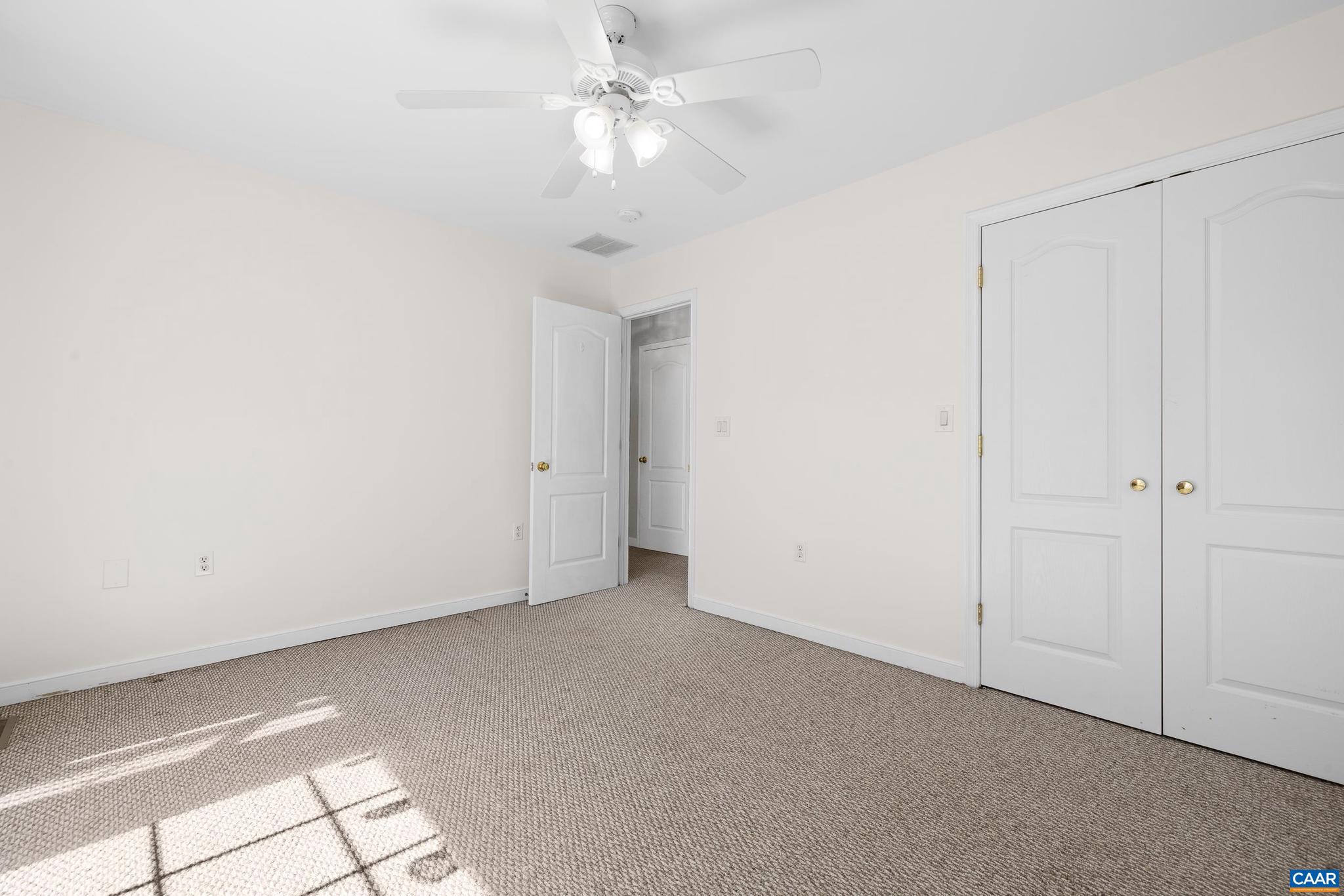 1075 Social Hall Road New Canton, VA 23123 - Photo 8 of 64 an empty room with a ceiling fan and a window