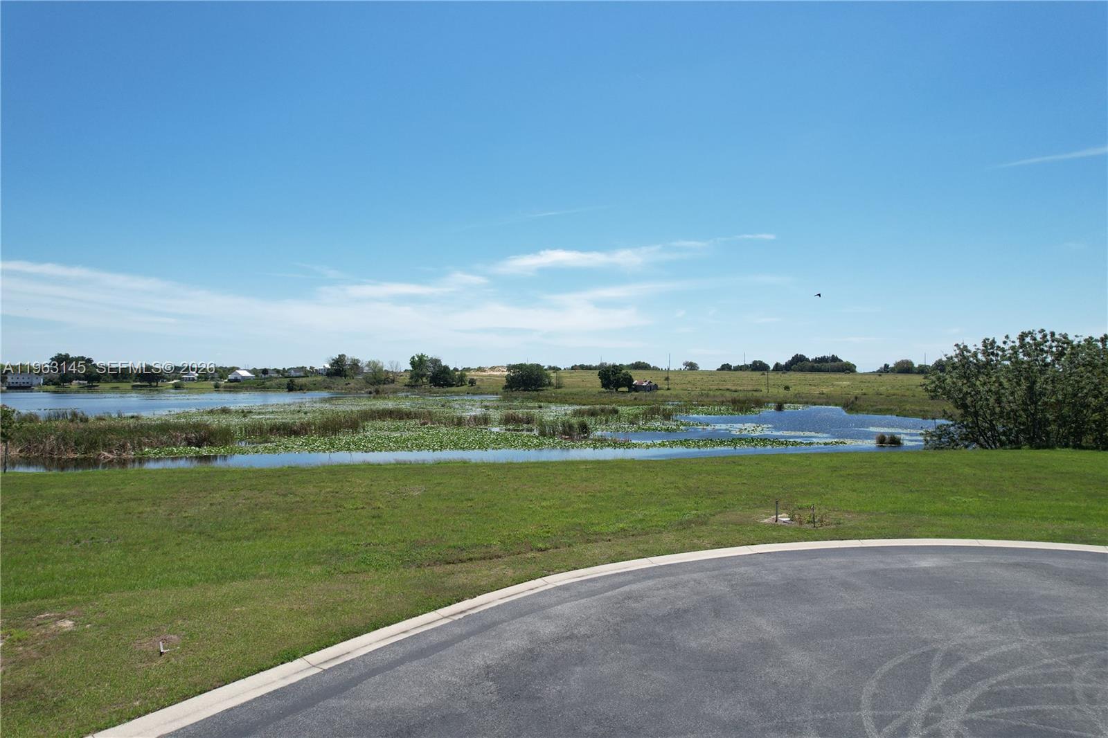a view of a lake with a big yard