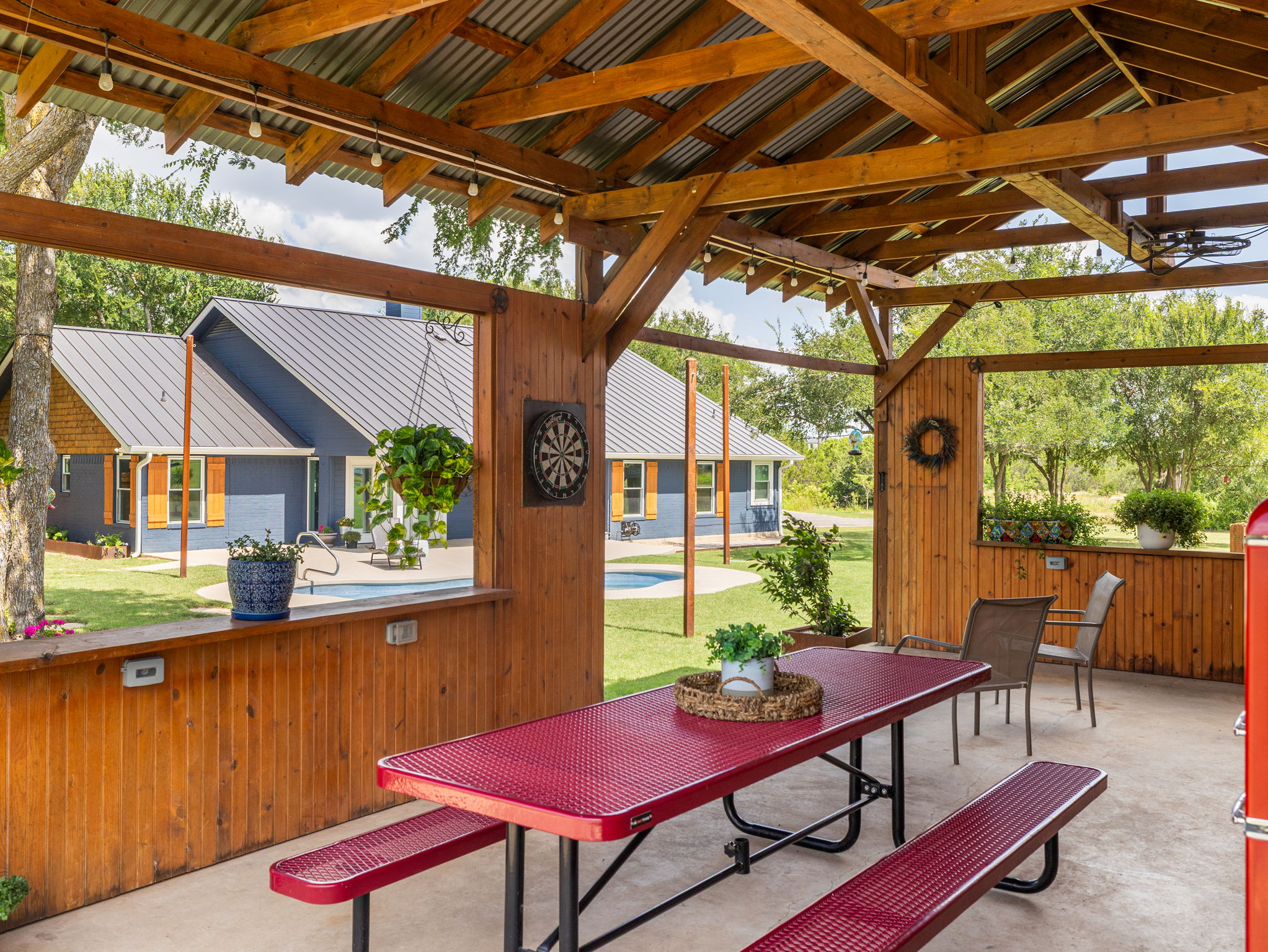 3001 County Road 255 Georgetown, TX 78633 - Photo 24 of 35 The covered outdoor pavilion provides a shaded dining space, perfect for entertaining by the pool with open views.