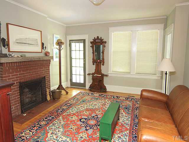 The 1st Floor Living Room w/ Beautiful Hardwoods & Masonry Fireplace. Living Room