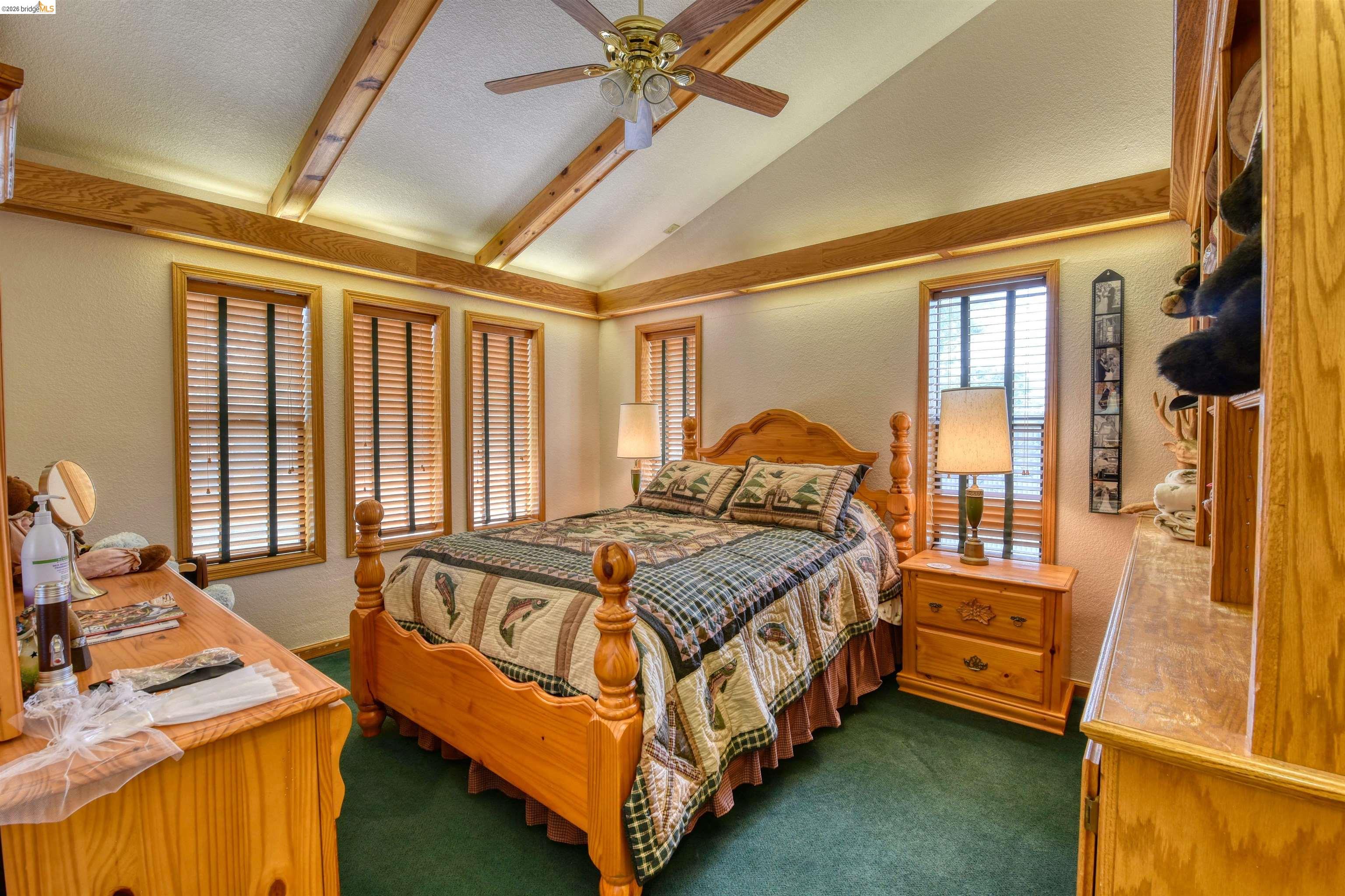 20950 Ferretti Road Groveland, CA 95321 - Photo 24 of 27 a bedroom with a bed and a window