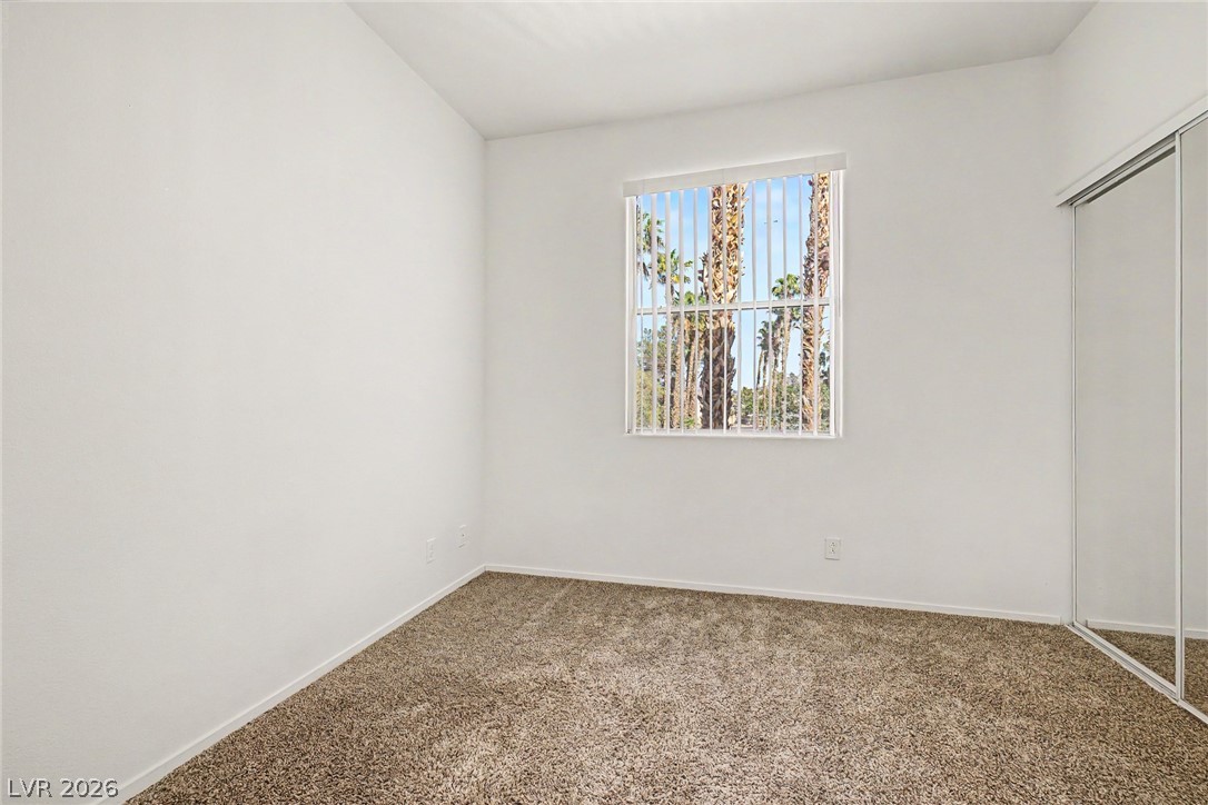 2223 Ramsgate Drive Henderson, NV 89074 - Photo 18 of 32 Well-lit room featuring ample closet space and verdant palm views.