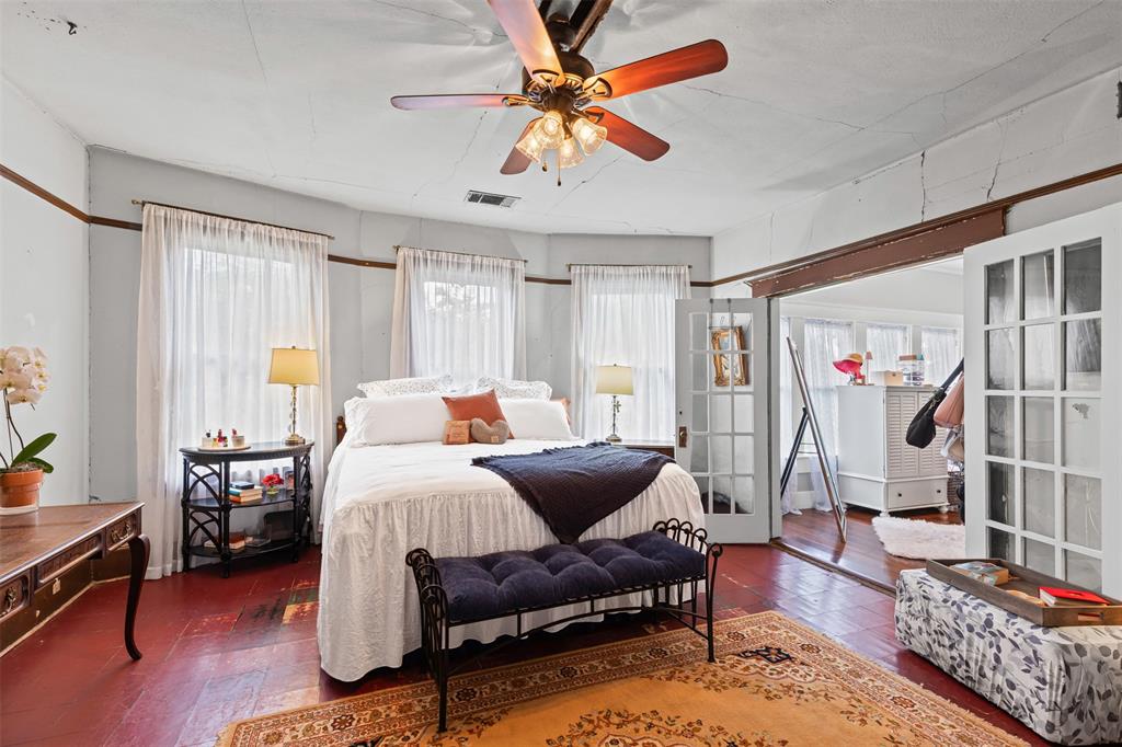 4606 East Side Avenue Dallas, TX 75226 - Photo 16 of 38 a bedroom with furniture and a window