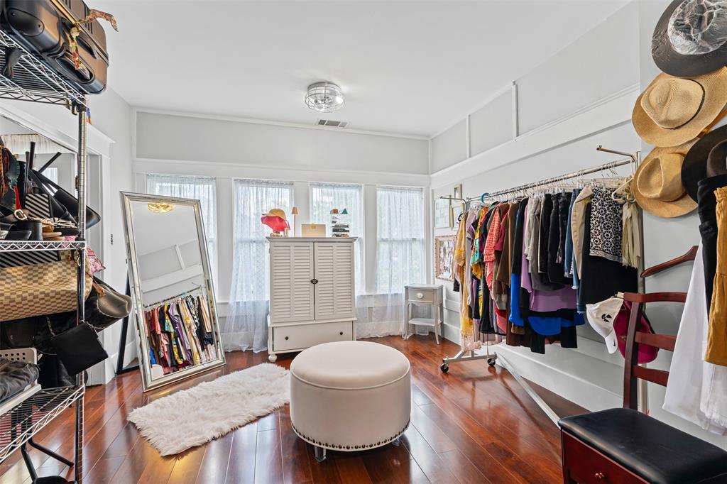 4606 East Side Avenue Dallas, TX 75226 - Photo 18 of 38 a walk in closet with wooden floor and shoes
