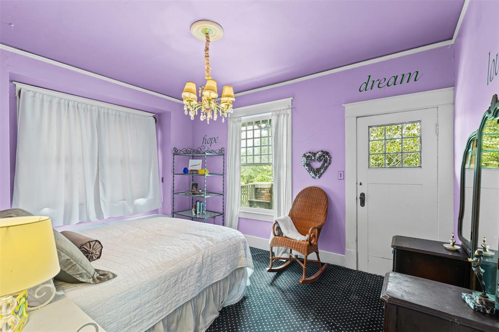 4606 East Side Avenue Dallas, TX 75226 - Photo 20 of 38 a bedroom with a bed dresser and a window