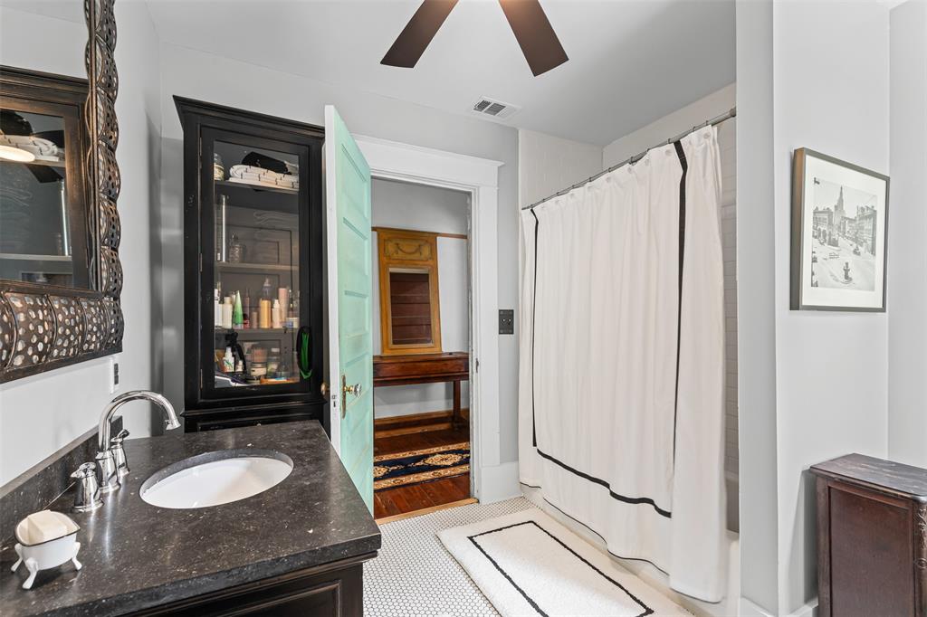 4606 East Side Avenue Dallas, TX 75226 - Photo 24 of 38 a bathroom with a granite countertop sink and a mirror