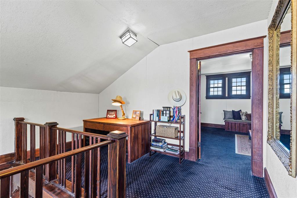 4606 East Side Avenue Dallas, TX 75226 - Photo 26 of 38 a view of a hallway with workspace and wooden floor