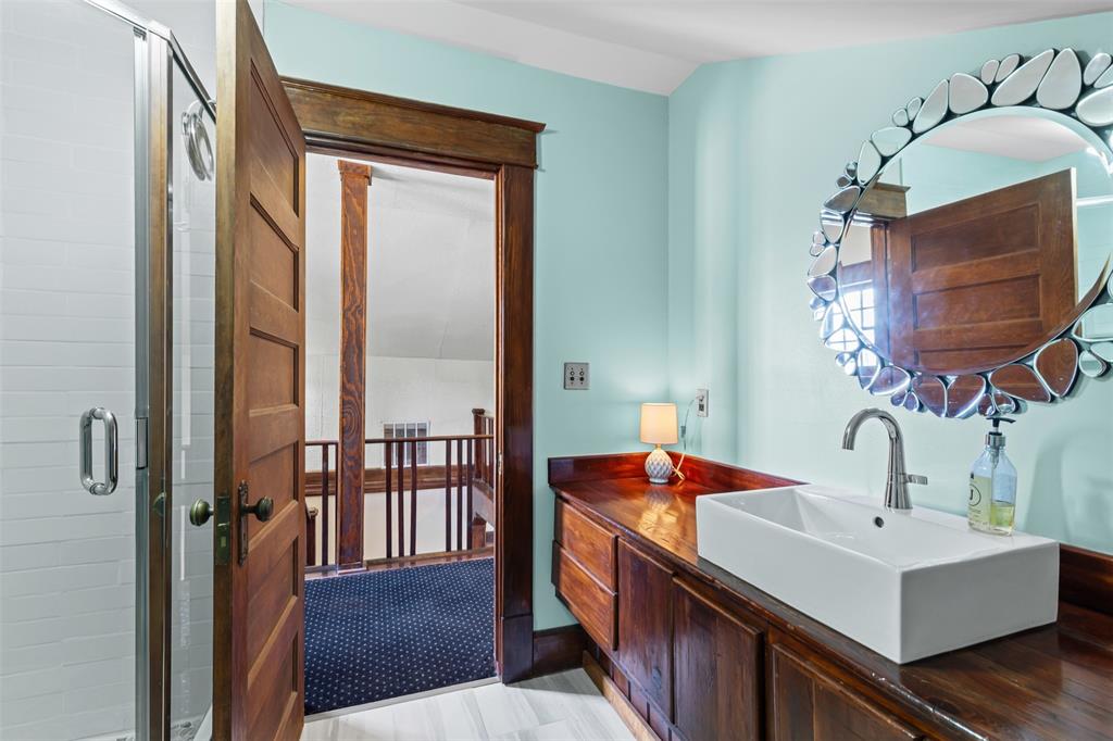 4606 East Side Avenue Dallas, TX 75226 - Photo 27 of 38 a bathroom with a sink and a mirror