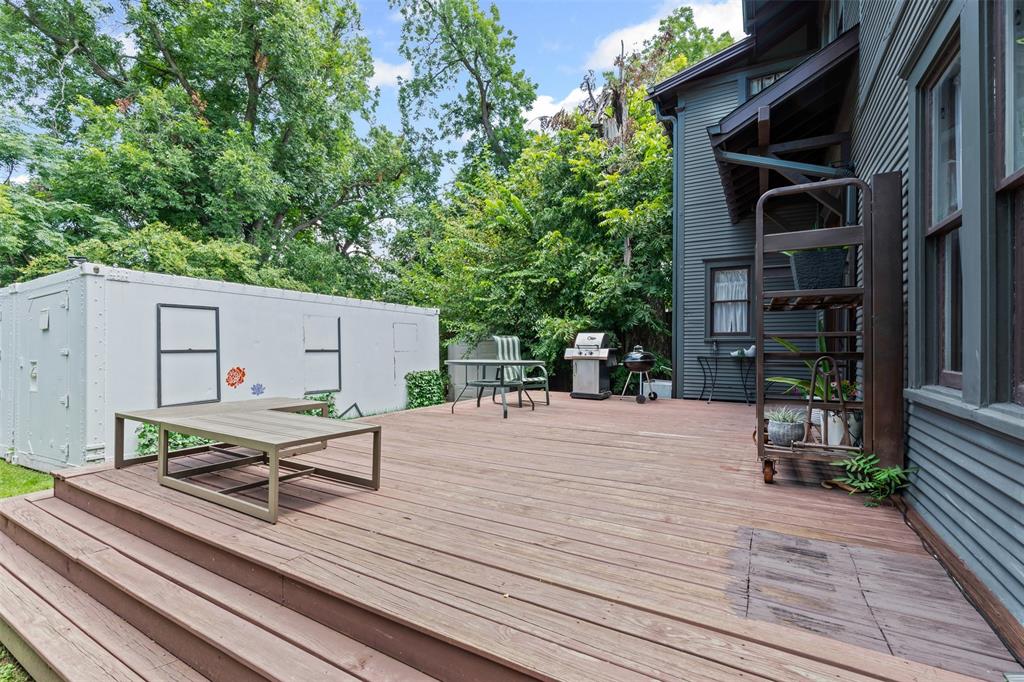 4606 East Side Avenue Dallas, TX 75226 - Photo 30 of 38 a lawn chairs sitting on a wooden floor