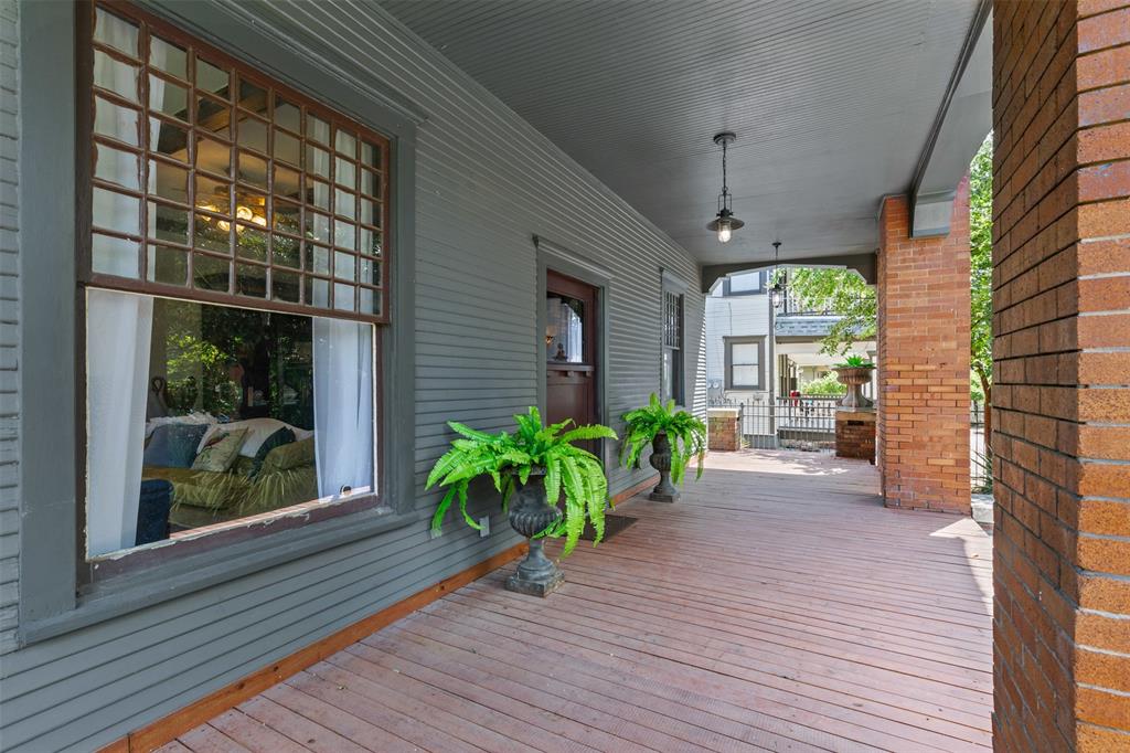 4606 East Side Avenue Dallas, TX 75226 - Photo 5 of 38 a view of a house with potted plants and a pathway