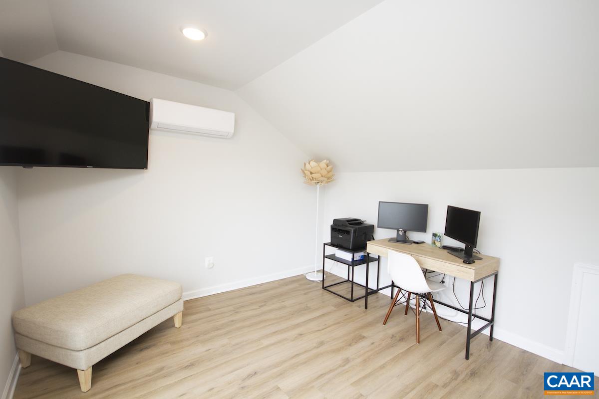 2174 Avinity Loop Charlottesville, VA 22902 - Photo 17 of 34 a workspace with furniture and wooden floor