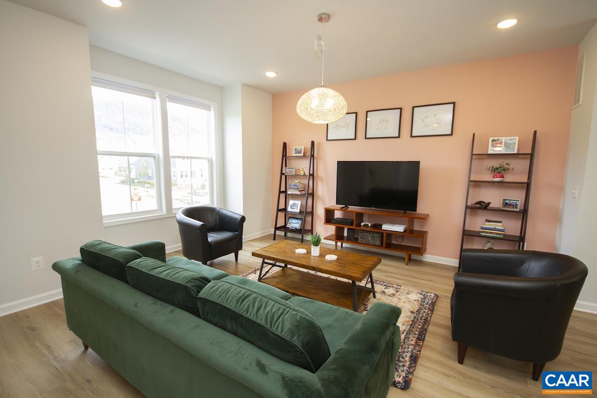 2174 Avinity Loop Charlottesville, VA 22902 - Photo 4 of 34 a living room with furniture and a flat screen tv