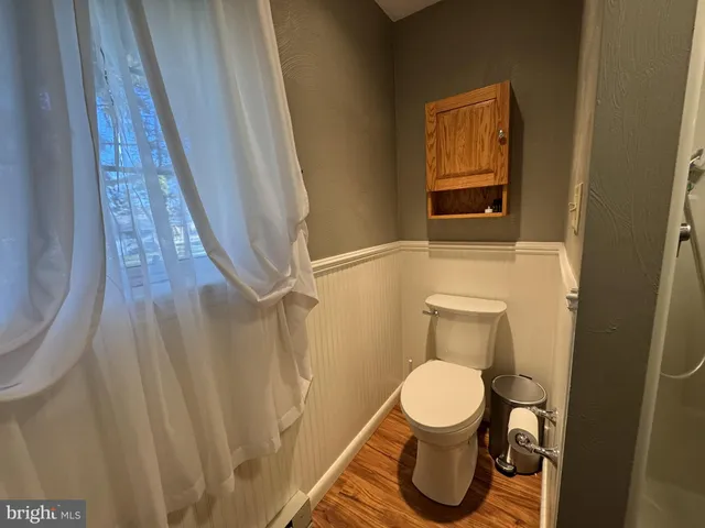a bathroom with a toilet and a sink