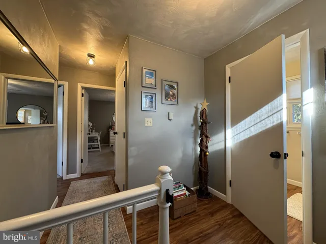 a view of hallway with a mirror