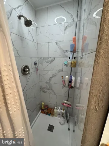 a bathroom with a sink and shower