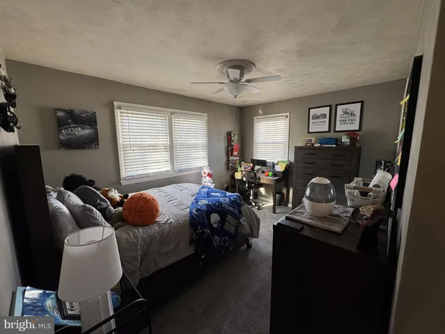 a bedroom with furniture and a window