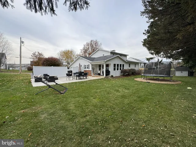a swimming pool view with a outdoor seating