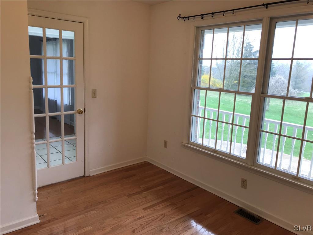 10 Frys Run Road Easton, PA 18042 - Photo 15 of 44 an empty room with wooden floor and windows
