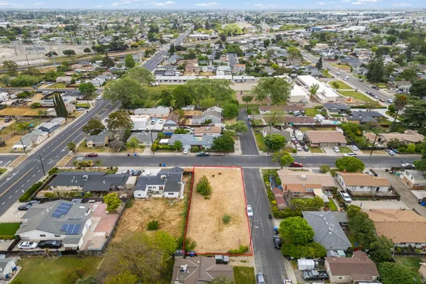 an aerial view of residential houses with outdoor space