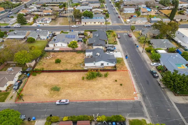 an aerial view of a house with a swimming pool