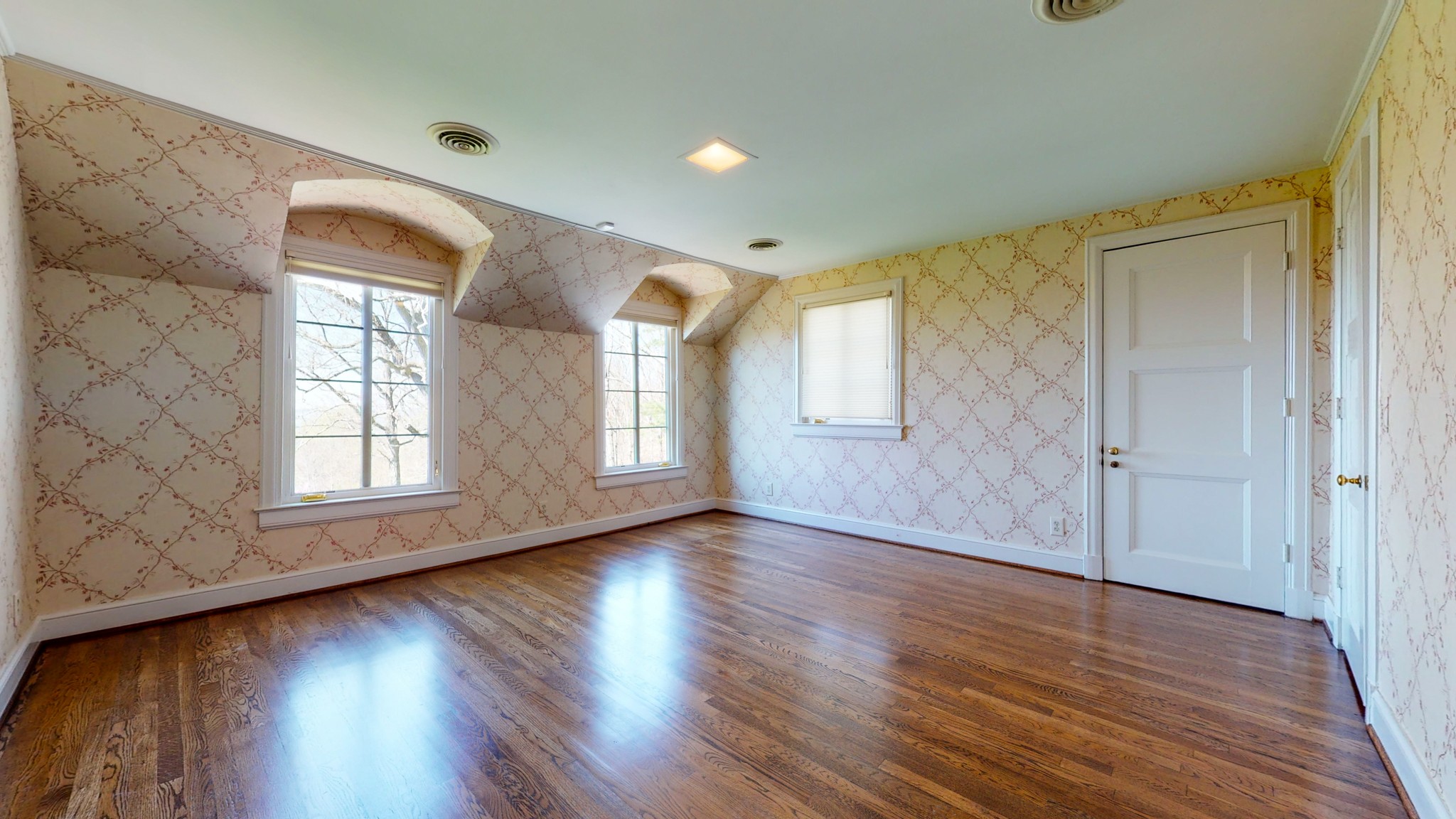 305 Clara's Point Road Sewanee, TN 37375 - Photo 36 of 46 an empty room with wooden floor and windows