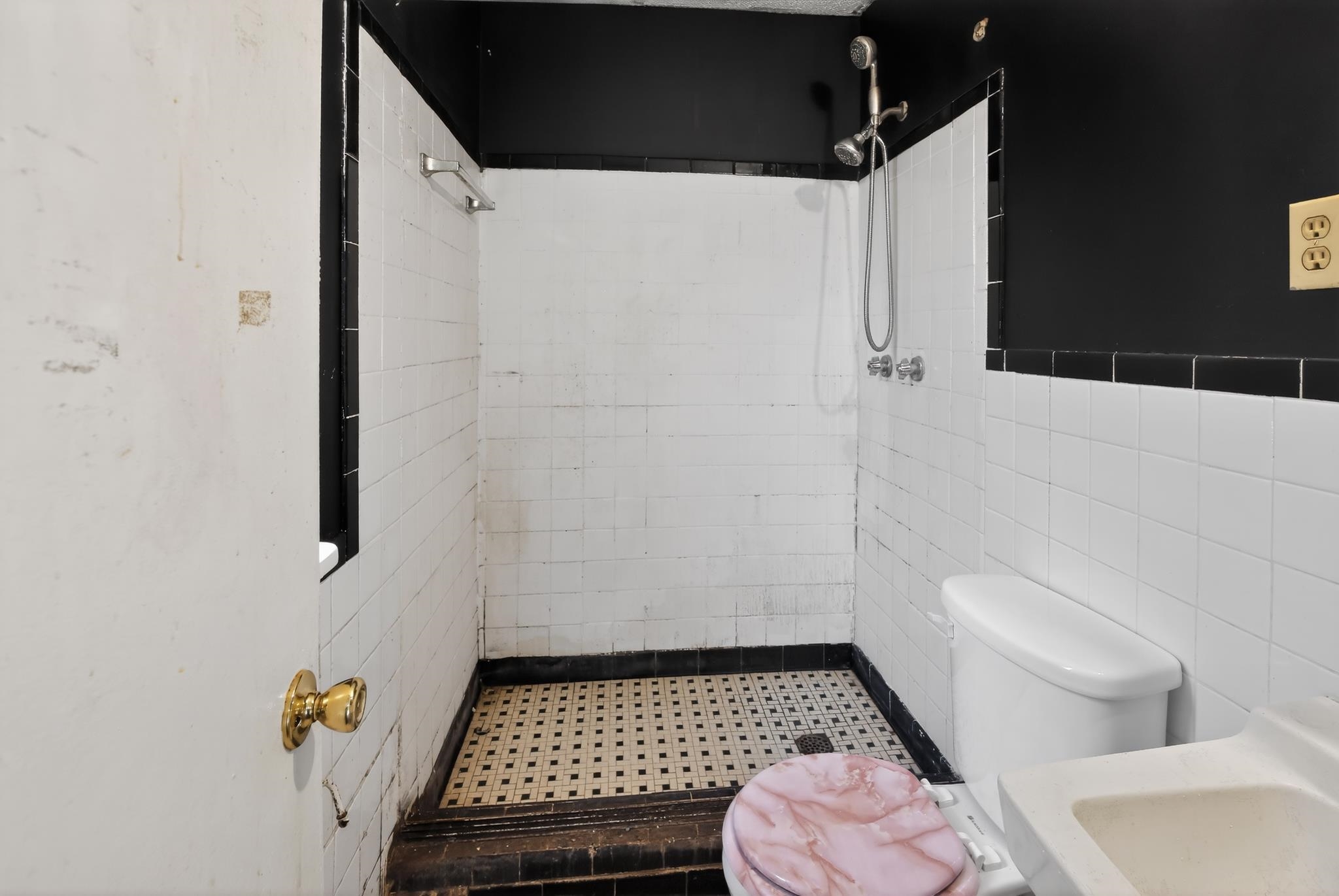 645 Parkrose Road Memphis, TN 38109 - Photo 19 of 32 Tiled shower enclosure featuring a black and white mosaic floor