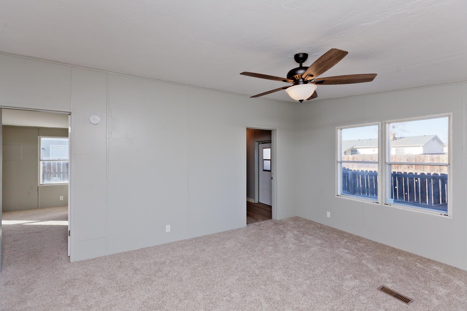 3066 Cardinal Court Grand Junction, CO 81504 - Photo 14 of 41 a view of a livingroom with a ceiling fan and window