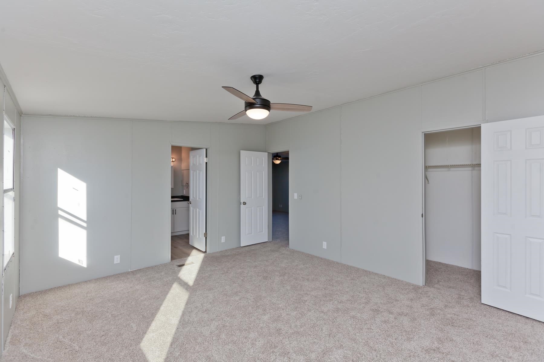 3066 Cardinal Court Grand Junction, CO 81504 - Photo 19 of 41 an empty room with closet and windows
