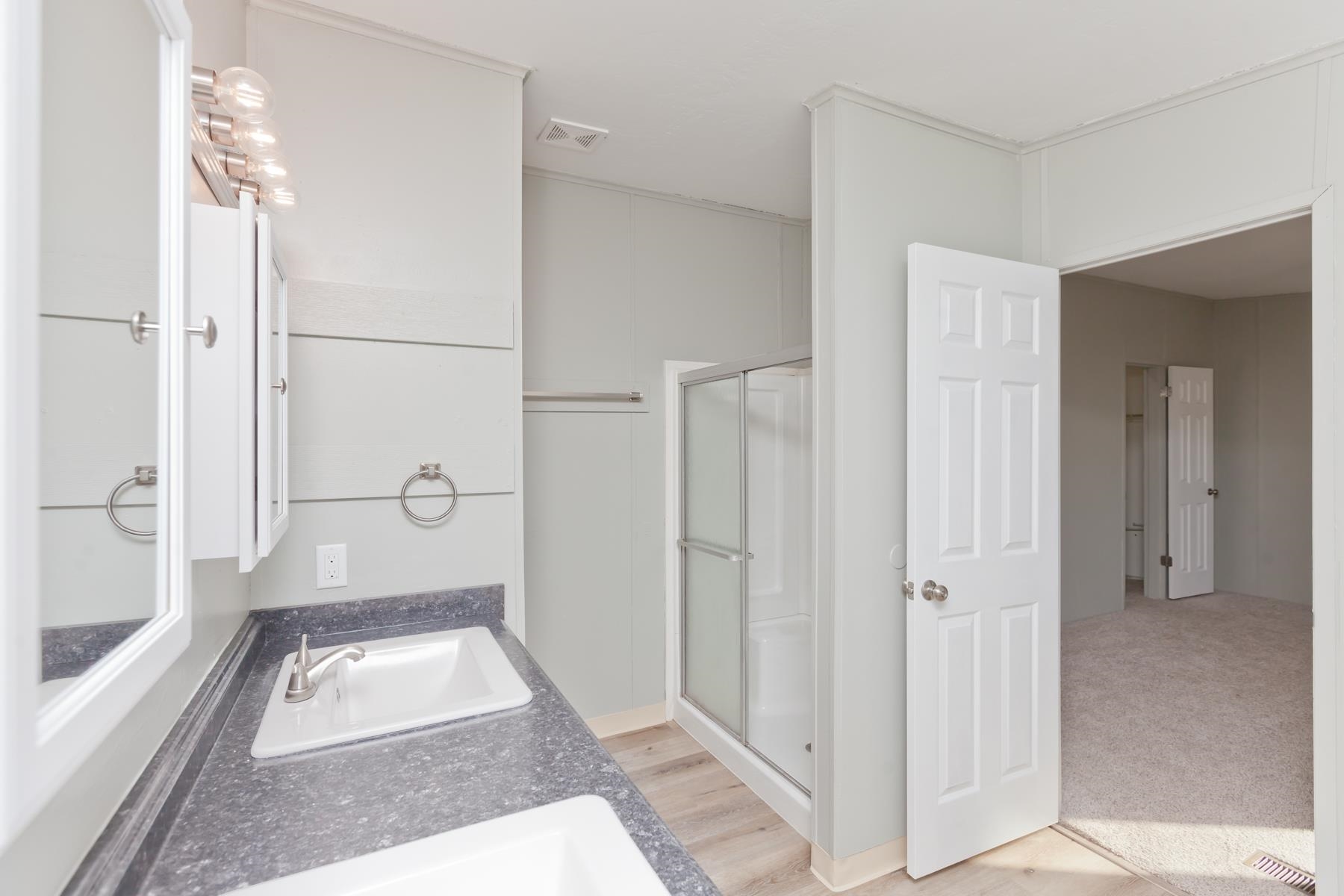 3066 Cardinal Court Grand Junction, CO 81504 - Photo 24 of 41 a bathroom with a tub shower and sink