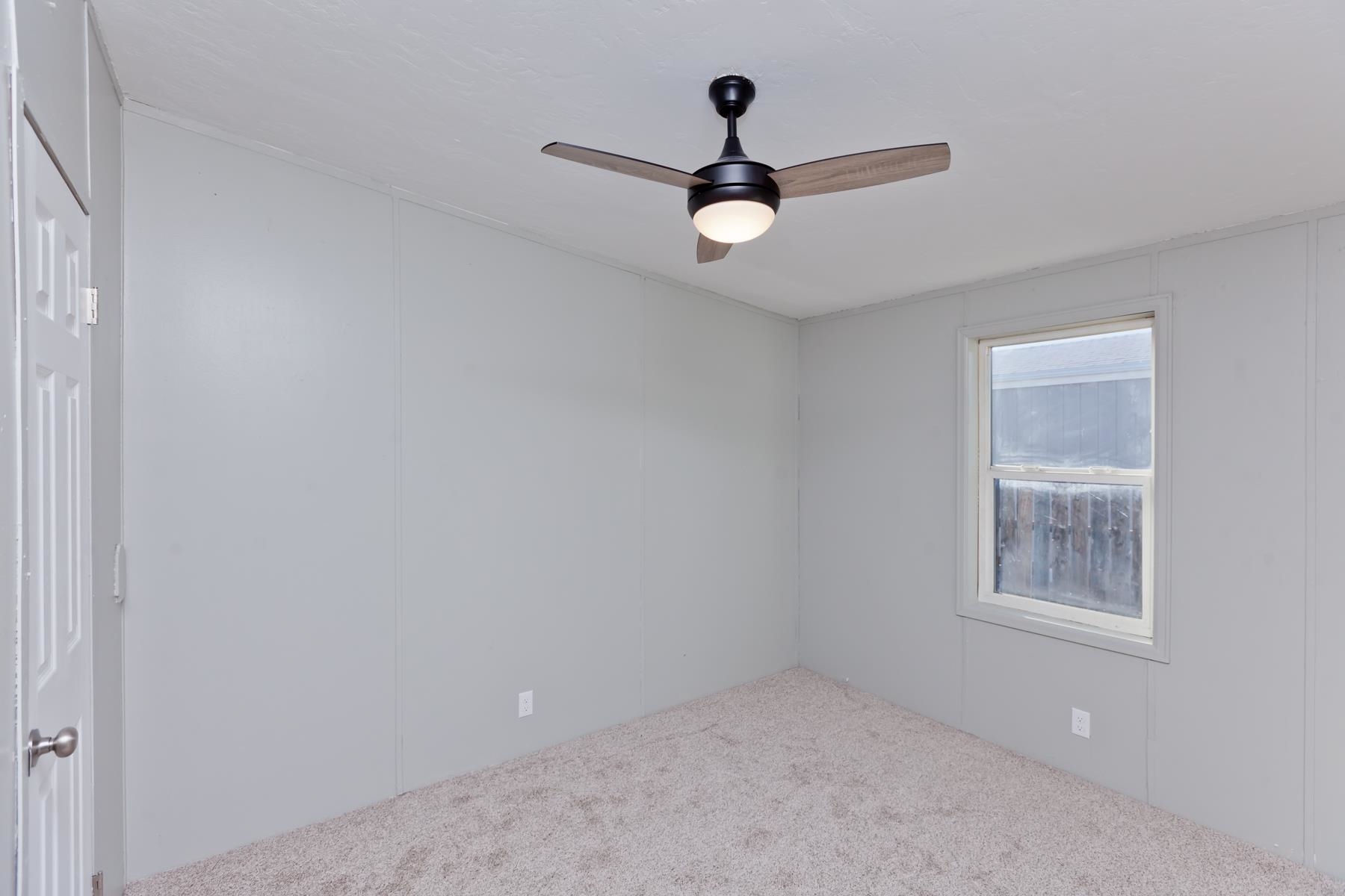 3066 Cardinal Court Grand Junction, CO 81504 - Photo 28 of 41 an empty room with a window and a fan