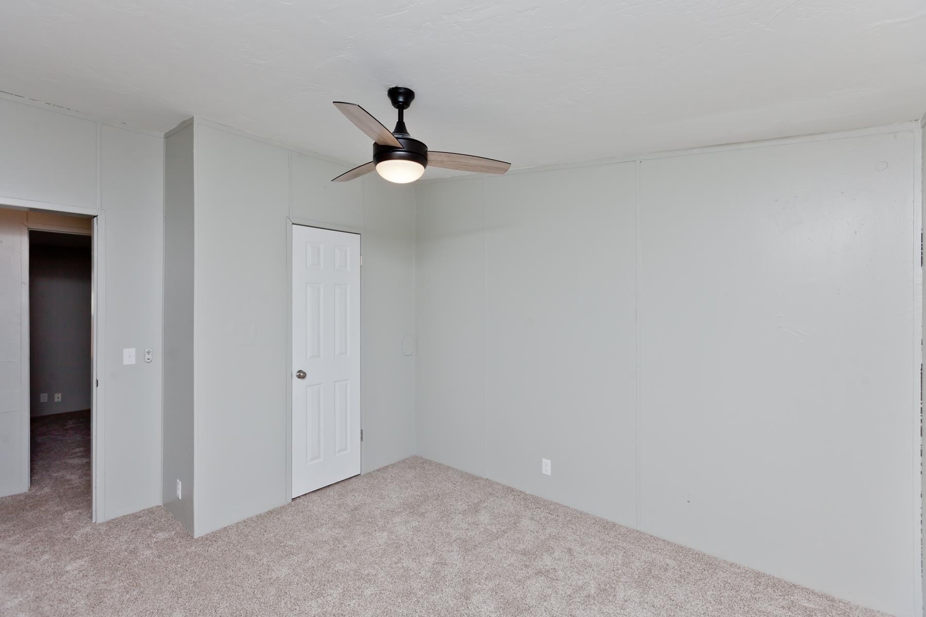 3066 Cardinal Court Grand Junction, CO 81504 - Photo 29 of 41 a view of an empty room and chandelier fan
