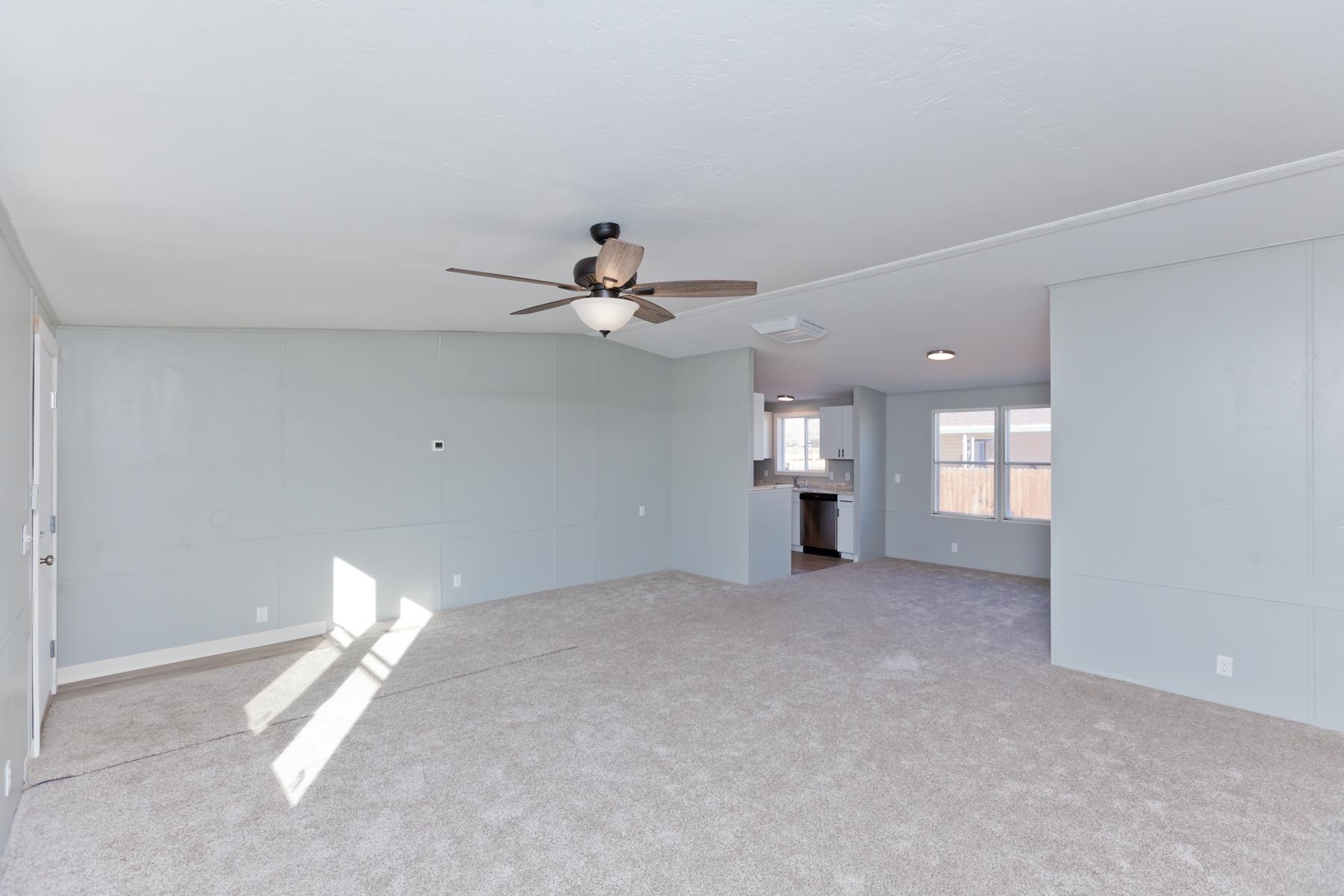 3066 Cardinal Court Grand Junction, CO 81504 - Photo 3 of 41 a view of empty room with a fireplace