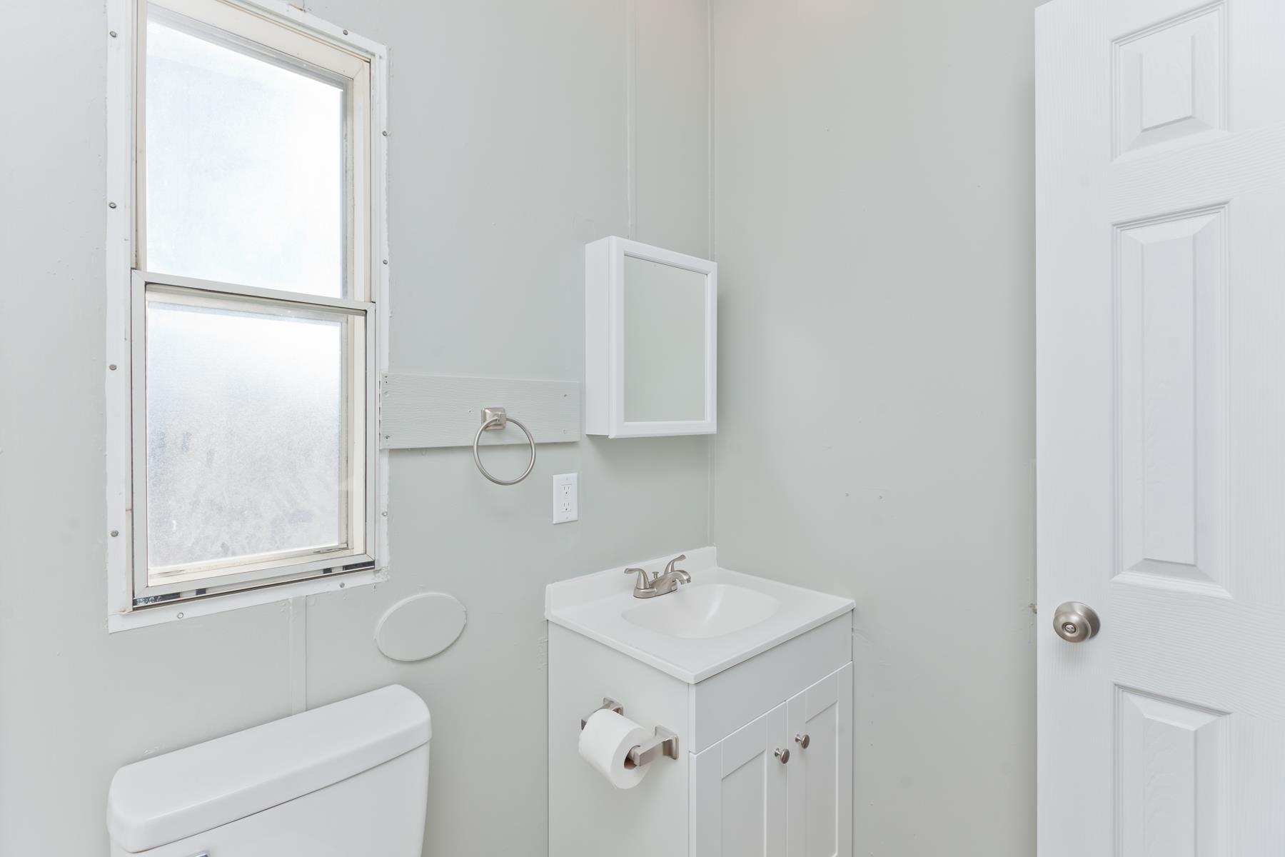 3066 Cardinal Court Grand Junction, CO 81504 - Photo 31 of 41 a bathroom with a sink a toilet and a mirror