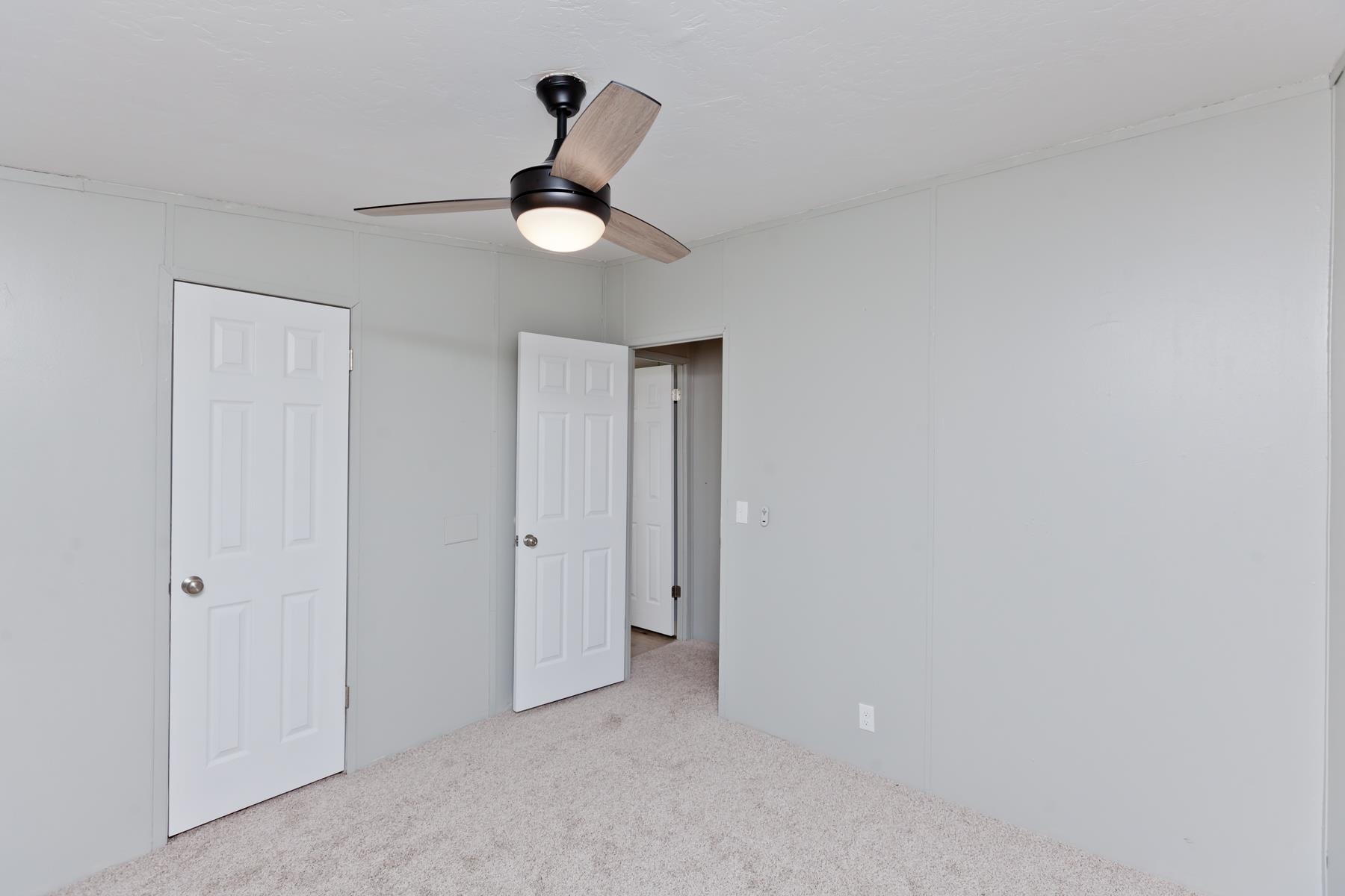 3066 Cardinal Court Grand Junction, CO 81504 - Photo 35 of 41 a view of a room with a ceiling fan and a window