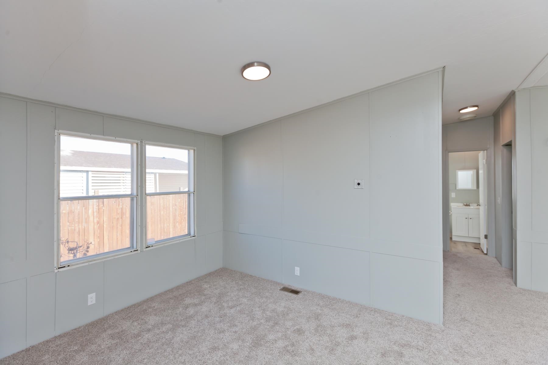 3066 Cardinal Court Grand Junction, CO 81504 - Photo 5 of 41 an empty room with windows and closet