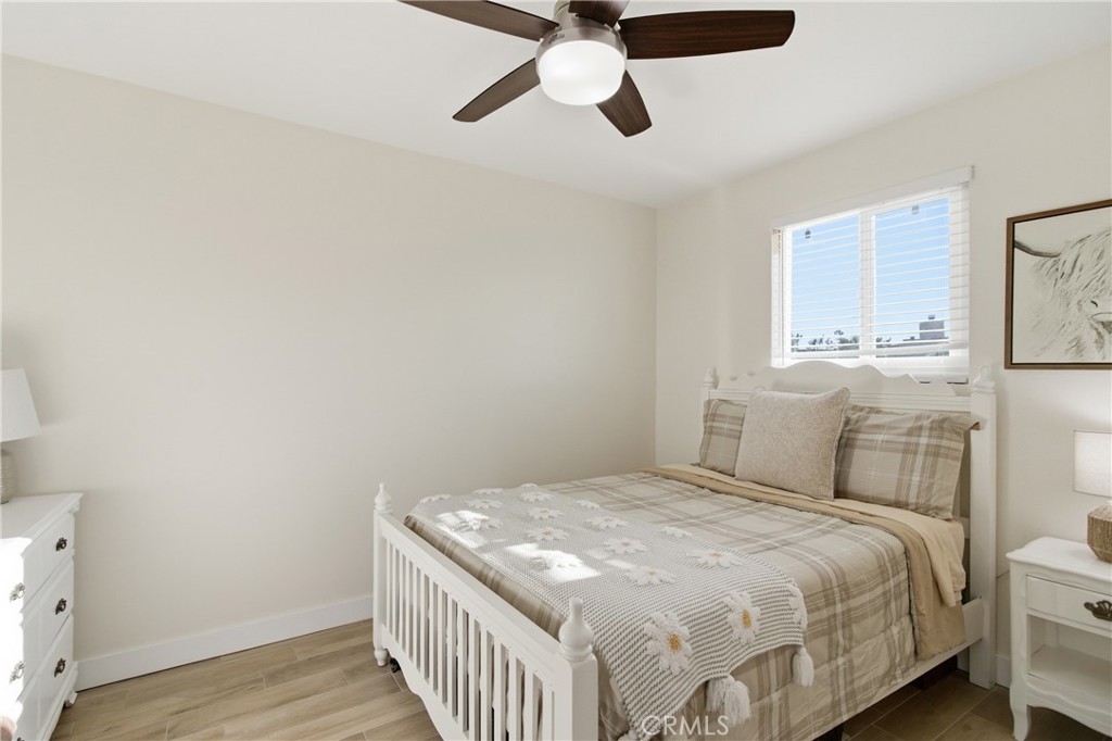 3552 Condalia Avenue Yucca Valley, CA 92284 - Photo 16 of 30 a bedroom with a bed and cabinets